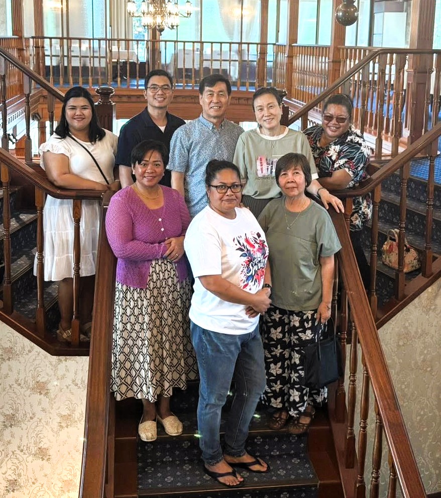 Group of people posing for group photo